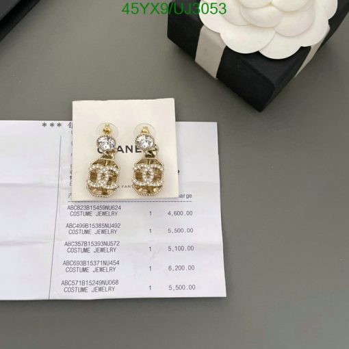 Earrings on receipt with prices beside a gift box.