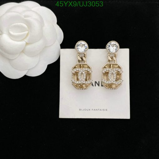 Elegant crystal-encrusted gold earrings with white flower.