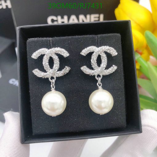 Designer pearl and crystal logo earrings in box.