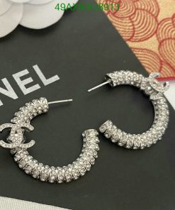 Designer crystal hoop earrings on display.