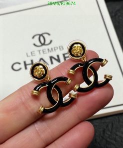 Designer gold and black logo earrings.