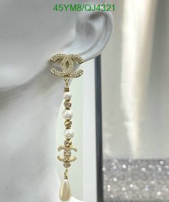 Luxury pearl dangle earring displayed on mannequin.