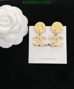 Designer logo drop earrings on white background.