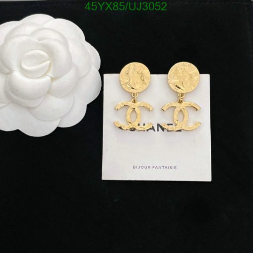 Designer logo drop earrings on white background.