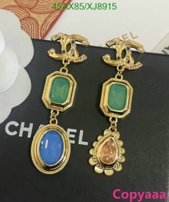 Vintage-inspired gold earrings with colored gemstones.