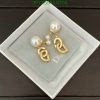 Designer pearl drop earrings in presentation box.