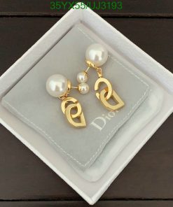 Designer pearl drop earrings in presentation box.