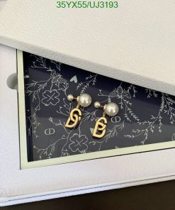 Pearl earrings in an open jewelry box.