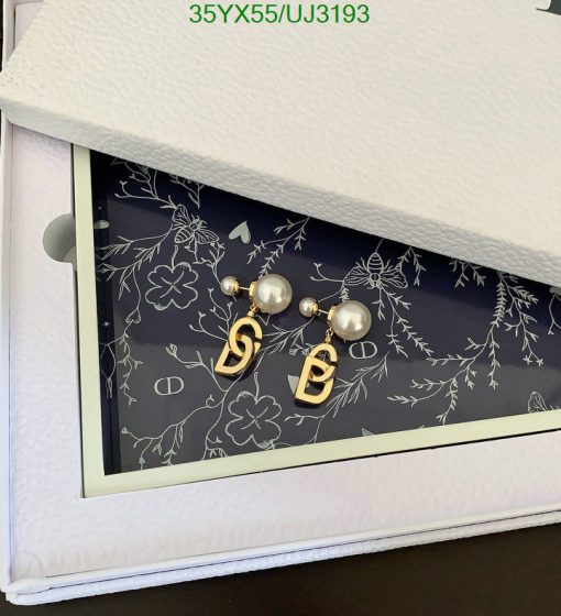 Pearl earrings in an open jewelry box.