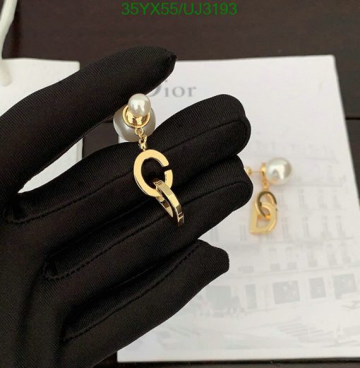 Gold designer logo earrings with pearl detail.