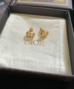 Gold Dior logo earrings in branded box.