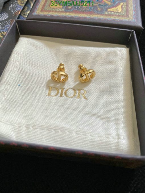 Gold Dior logo earrings in branded box.