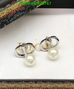 Pearl earrings with silver and gold accents.