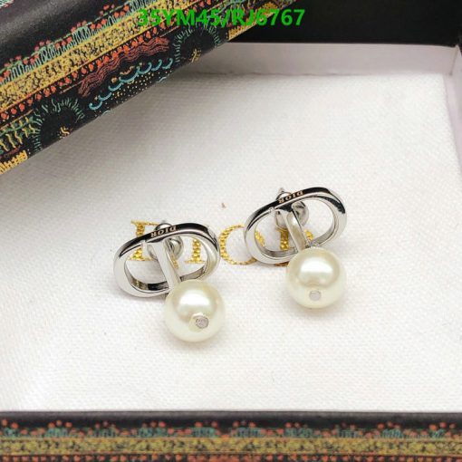 Pearl earrings with silver and gold accents.