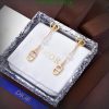 Dior pearl gold earrings in branded box.