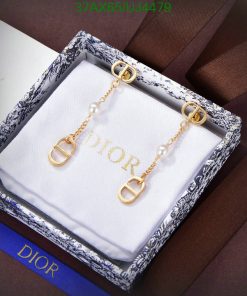 Dior pearl gold earrings in branded box.