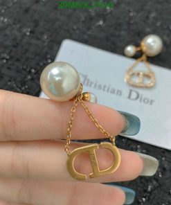 Pearl earring with Dior logo pendant.