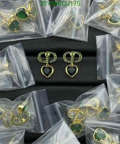 Assorted packaged green heart earrings.