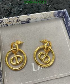 Gold designer logo earrings in presentation box.