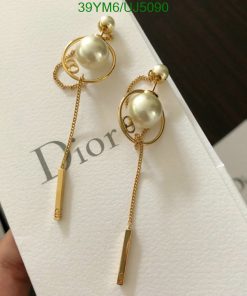 Elegant pearl gold drop earrings on branded card.