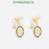 Pearl drop earrings with gold accents on white background.