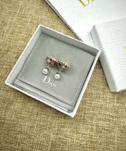 Dior bow earrings with pearls in branded box.