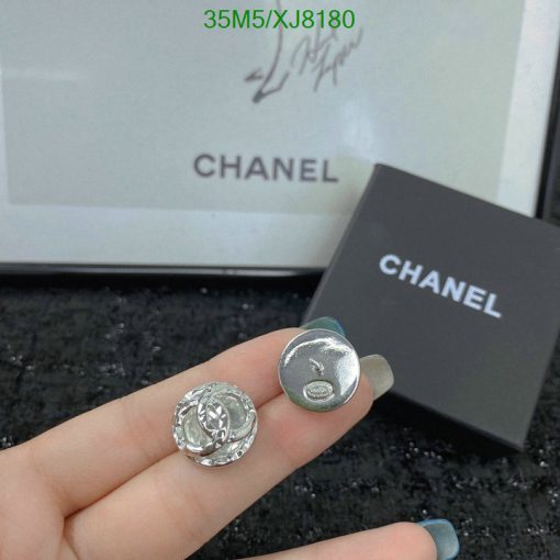 Chanel button close-up with packaging.