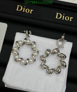 Dior pearl and chainlink hoop earrings on display.