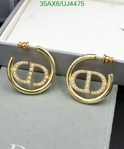 Gold hoop earrings with diamonds on display.