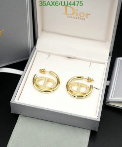 Gold Dior earrings in branded box.