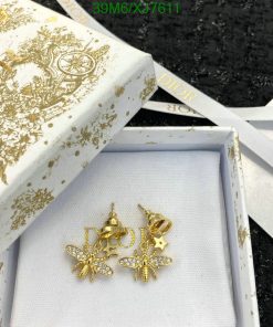 Dior gold earrings in branded box with ribbon.