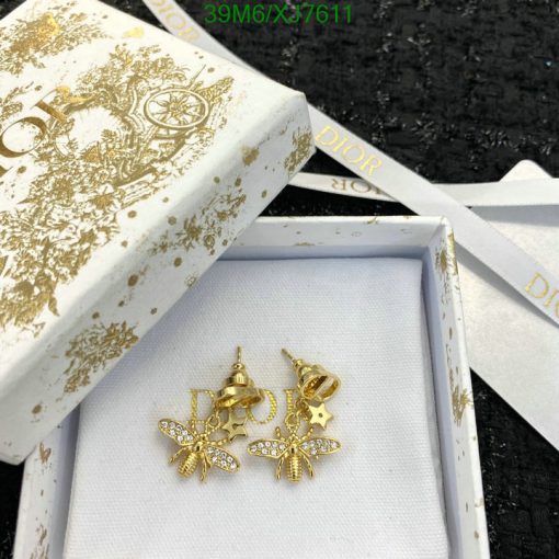 Dior gold earrings in branded box with ribbon.