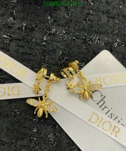 Dior golden bee earrings with packaging ribbon.