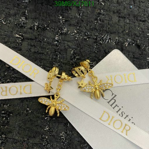 Dior golden bee earrings with packaging ribbon.