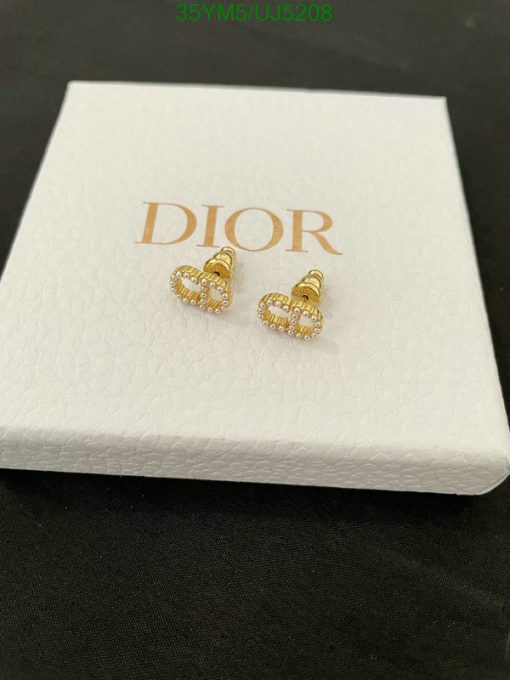 Dior gold-tone heart-shaped earrings on branded box.