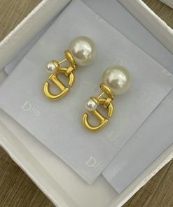 Pearl earrings with gold accents in box.