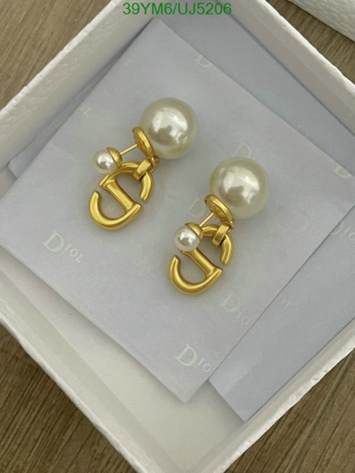 Pearl earrings with gold accents in box.