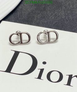 Silver Dior logo earrings on branded card.