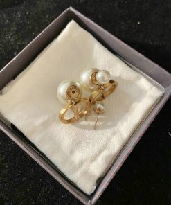 Pearl earrings in box, jewelry fashion accessory.