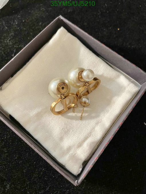 Pearl earrings in box, jewelry fashion accessory.