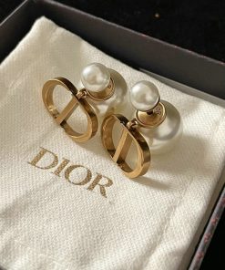 Pearl earrings with Dior logo in branded box.