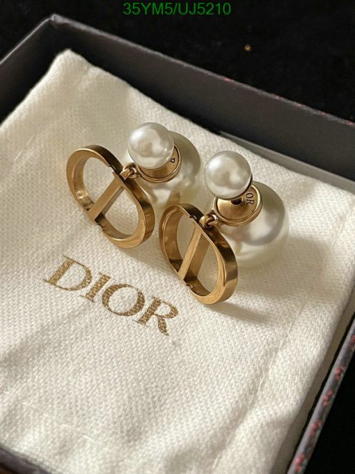 Pearl earrings with Dior logo in branded box.