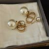 Pearl earrings in box, jewelry fashion accessory.