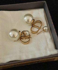 Pearl earrings in box, jewelry fashion accessory.