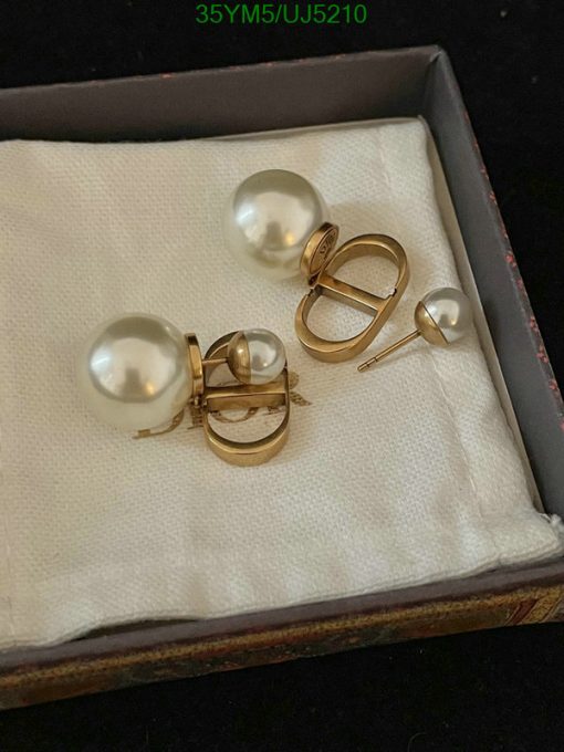 Pearl earrings in box, jewelry fashion accessory.