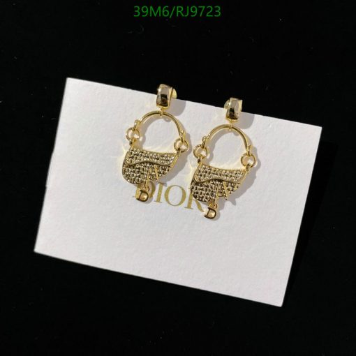 Gold hoop earrings with logo detail on display.