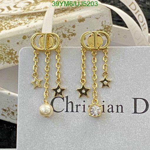 Designer gold earrings with stars, pearl, and diamond accents.