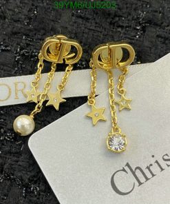 Gold star and gemstone dangle earrings.