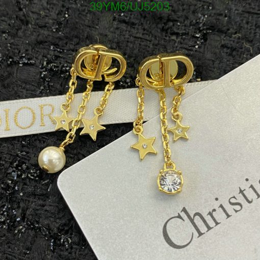 Gold star and gemstone dangle earrings.