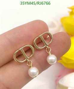 Gold buckle earrings with pearls.